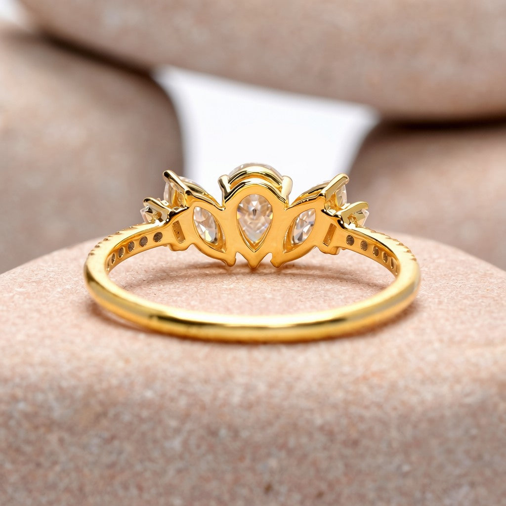 0.70 Carat Pear Cut Moissanite Diamond Three Stone Engagement Ring