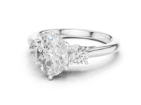 1.5 Carat Oval Shape Diamond Ring with Side Brilliant Diamonds