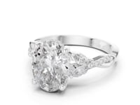 3 Carat Oval Shape Center Diamond with Tapered Side Stones