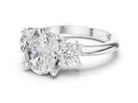 2.5 Carat Oval Diamond Three-Stone Engagement Ring with Round Side Stones