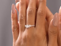 0.70 Carat Pear Cut Moissanite Diamond Three Stone Engagement Ring
